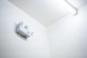 Automatic EMERGENCY LIGHT in hospital is charging and power pluging on the wall that ready to use when the power went out.1 photo