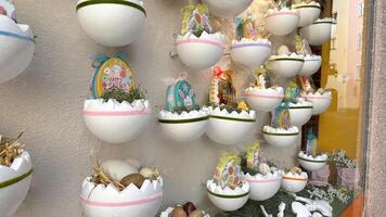 28.03.2025 Innsbruck, Colorful Easter Decorations Featuring Eggs and Baskets on Display in Store Window. Easter-themed decorations showcasing intricately designed eggs and baskets photo