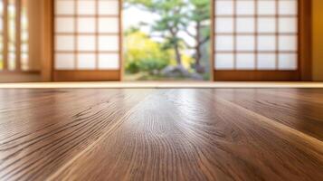 Elegant walnut tabletop set against blurry Japanese style tea room with soft tatami mats and sliding wooden doors in distance photo