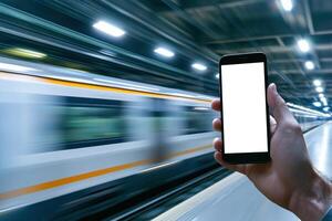 Hand holding smartphone displaying train tracking app with high speed train in motion, creating sense of urgency photo