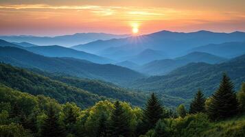breathtaking view of evergreen forested mountains sunrise, with layers of misty blue ridges and glowing sun casting warm light over serene photo