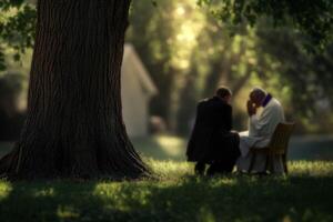 a Priest listening to man talking about problems in outdoor tree trunk. photo