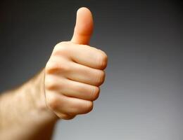 thumb up hand with white background isolate. photo