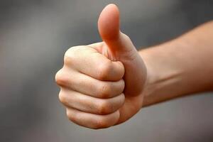 hand with thumb up, making the ok symbol. with white background isolate. photo