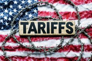 Import Trade Tariffs increase concept with United States of America Flag. Trade wars photo