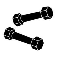Dumbbells resting on a gym floor after a weightlifting session in the early morning vector