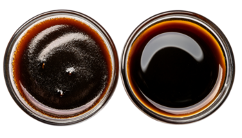 top view of two types of soy sauce in glass bowls on isolated background for asian cooking ingredient and condiment collection png