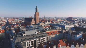 Aerial view of Wroclaw, Poland, showcasing red roofed buildings, the Oder River with bridges, and Gothic style Cathedral of St. John the Baptist. video