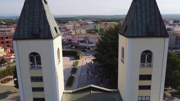 Close up view of the church of Medjugorje symbol of the city and of the apparition of the Madonna. Aerial view of the landmark structure of prayer and pilgrimage video