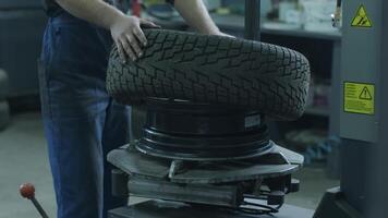 Tire service. Alignment of car rims. Tire machine for rolling and alignment of steel wheel rims close-up video