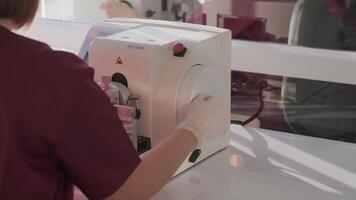 The laboratory assistant makes histological research, microtoming. Rotary Microtome Section for diagnosis in pathology make microscope slide histology. Human tissue equipment. video