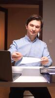 vertical Office worker giving a document and pointing at it with a pen video