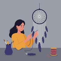 Woman crafting a dreamcatcher with feathers and thread at a table vector