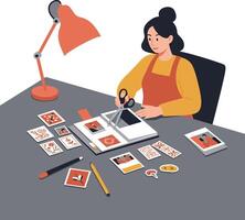 Woman crafting scrapbook pages with scissors and decorative elements on a desk vector
