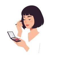 Woman applying makeup using a colorful palette in a bright, minimalist setting vector