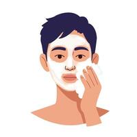 Young man applying facial cleanser while looking at the camera with a calm expression vector