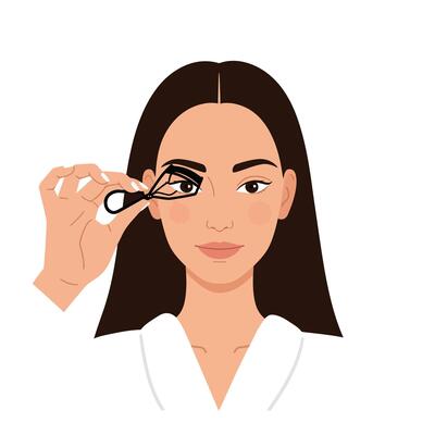 Woman using eyelash curler while applying makeup in stylish bathroom setting