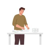Man folding laundry at a table in a flat illustration style vector
