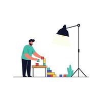 Man stacking colorful blocks under a lamp in flat art vector