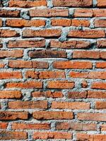 A brick wall with a few bricks on it photo