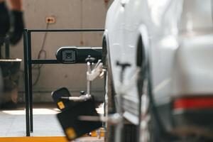 Close up view of the car, that is in the ,automobile repair salon photo