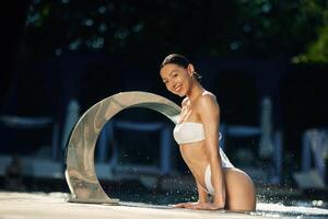 Conception of, resort and relax. Woman in white underwear is in the pool photo