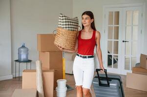 Young ,woman in, casual clothes is moving to new house photo