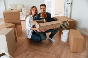 Young couple moving to new home photo