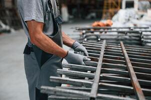 Close, up view of man that is working at the factory photo