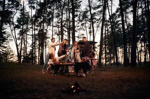 Group,, of friends are together in the forest photo