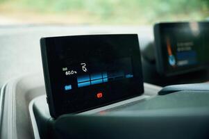 Close up view of display in the electric car that showing charging progress photo