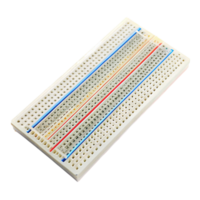 Close up of a breadboard used for circuit prototyping featuring rows of holes and power lines in a compact design png
