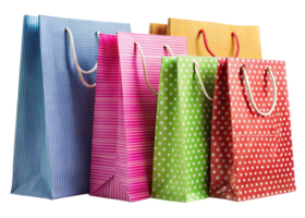 Set of colorful shopping bags with polka dot and striped patterns displayed on a white reflective background png