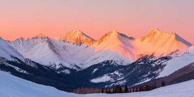 Snow-Capped Mountains at Sunrise. photo