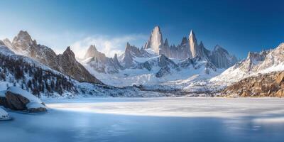 Snow-Covered Mountains Reflected in Frozen Lake photo