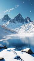 A snowy mountain landscape with a lake and mountains photo
