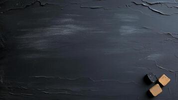 Black chalkboard background with chalk and pencils photo