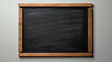 A blackboard with chalk on it hanging on a wall photo