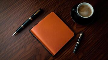 Coffee and notebook on a wooden table photo