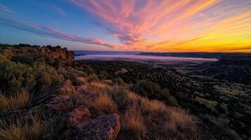 Sunrise over the canyon at the edge of the desert photo