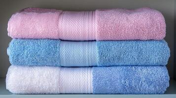 Neatly Folded Towels on Shelf photo