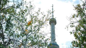 A clock tower with a clock on top of it photo
