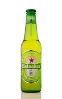 Gaziveren Cyprus -04.04.2025 Refreshing green bottle beer Haineken of premium malt lager displayed on a clean white background, inviting moments of relaxation and enjoyment for beer enthusiasts photo