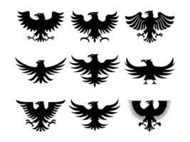 Set of nine black eagle silhouettes with spread wings in bold minimalist heraldic style and powerful symmetrical pose vector