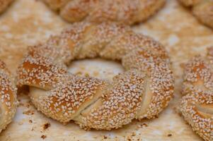 Delicious sesame bagels from a bustling bakery in the heart of the city during a sunny afternoon photo