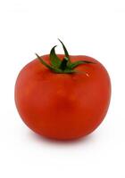Bright red tomato glistens under soft lighting showcasing its fresh texture and vibrant color in a minimalist setting photo