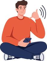 Young man sitting cross-legged on the floor in a cozy, casual setting, using a smartphone, in a flat illustration vector