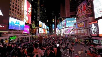 New York. US 10.04.2025 Times Square night view with neon lights, crowded streets and glowing billboards, Iconic New York location captured in vivid colors with motion and energy of tourists and city video