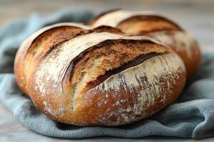 Rustic Artisan Sourdough Bread on Linen - Perfect for Culinary Designs and Food Photography photo