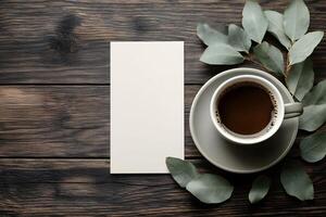 Rustic Coffee Break with Blank Card and Eucalyptus on Wooden Background for Branding Mockup photo